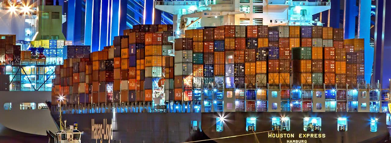 shipping containers on a boat at night