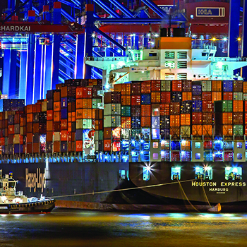 shipping containers on a boat at night