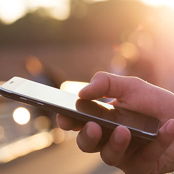 Close-up of hand holding cell-phone