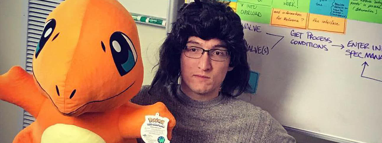 Teammate with funny wig and stuffed Charmander