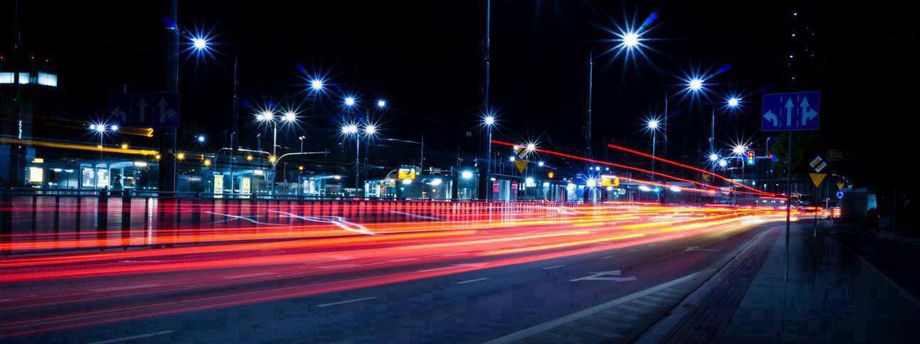 busy street with time-lapse streaks of light