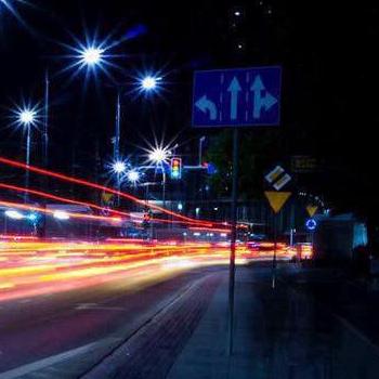 busy street with time-lapse streaks of light